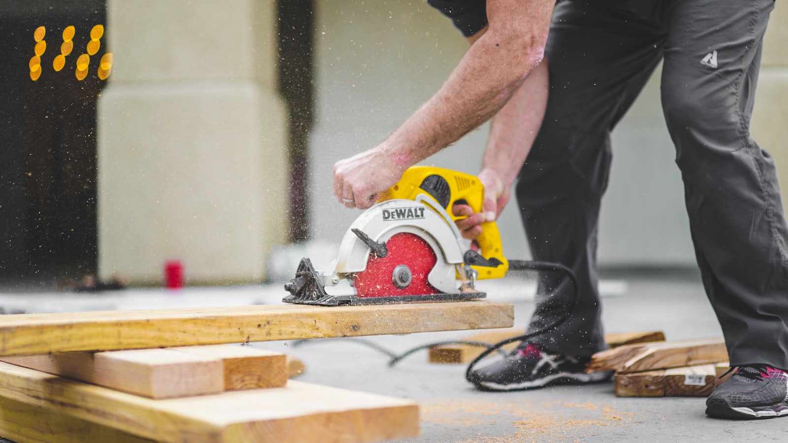 A circular saw cutting a wooden plank