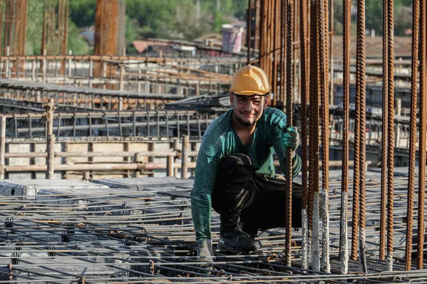 A worker in a hard hat on a construction site