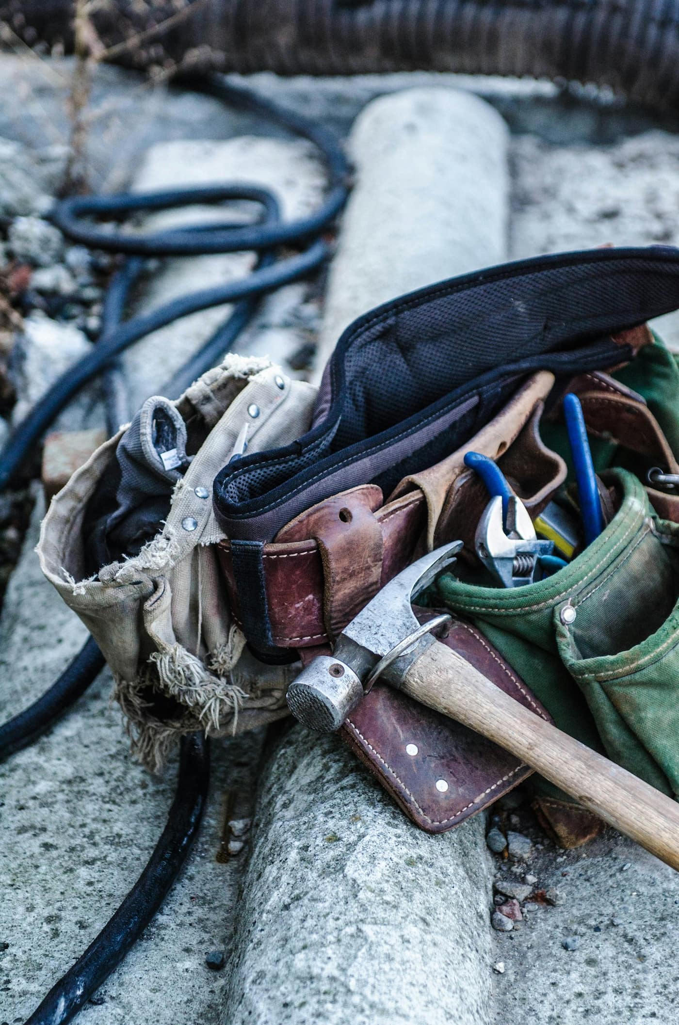 A hammer and a leather tool belt
