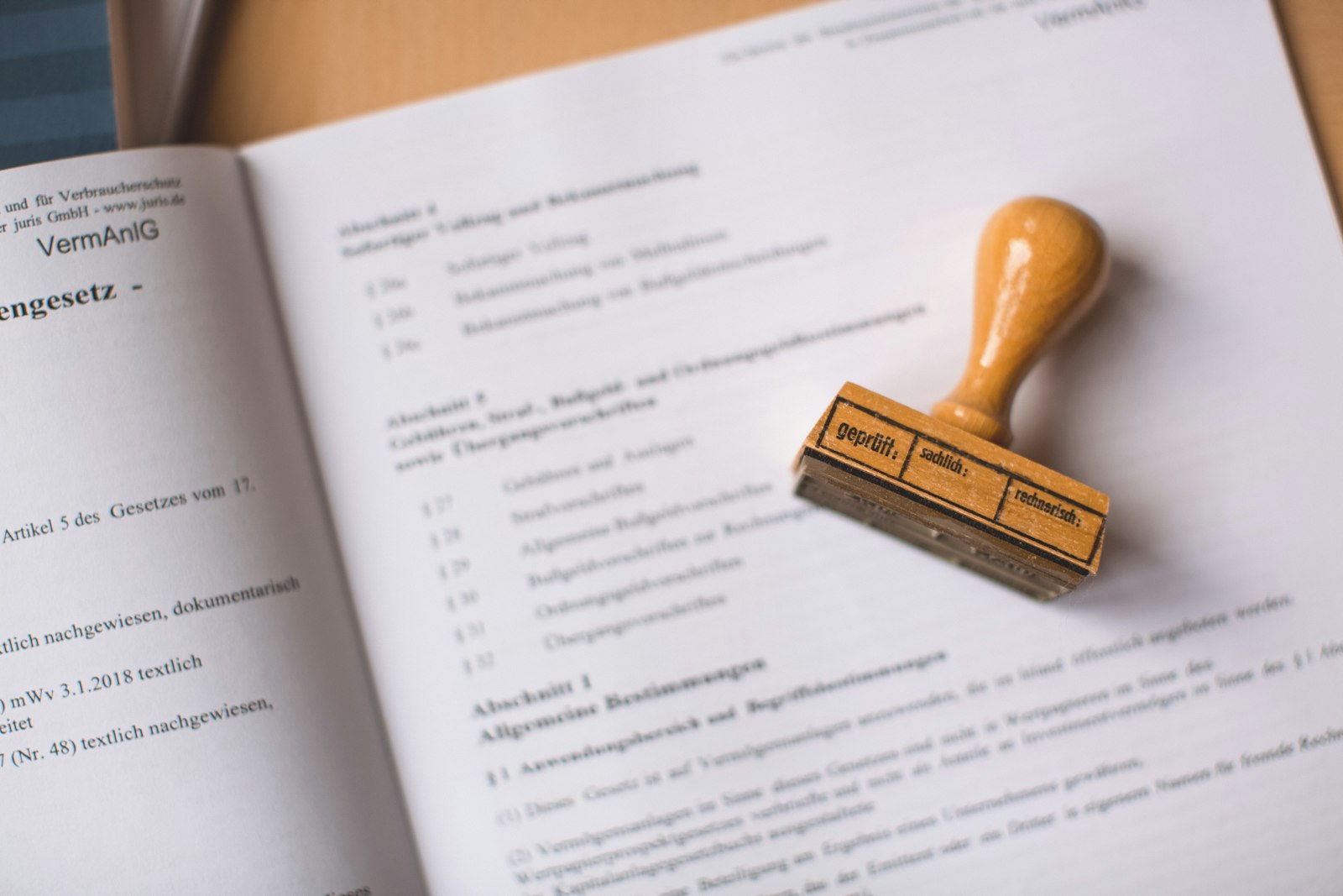 A stamp and paperwork on a desk