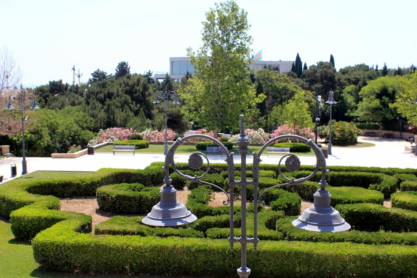 A well-maintained landscaped garden with hedges and a lawn