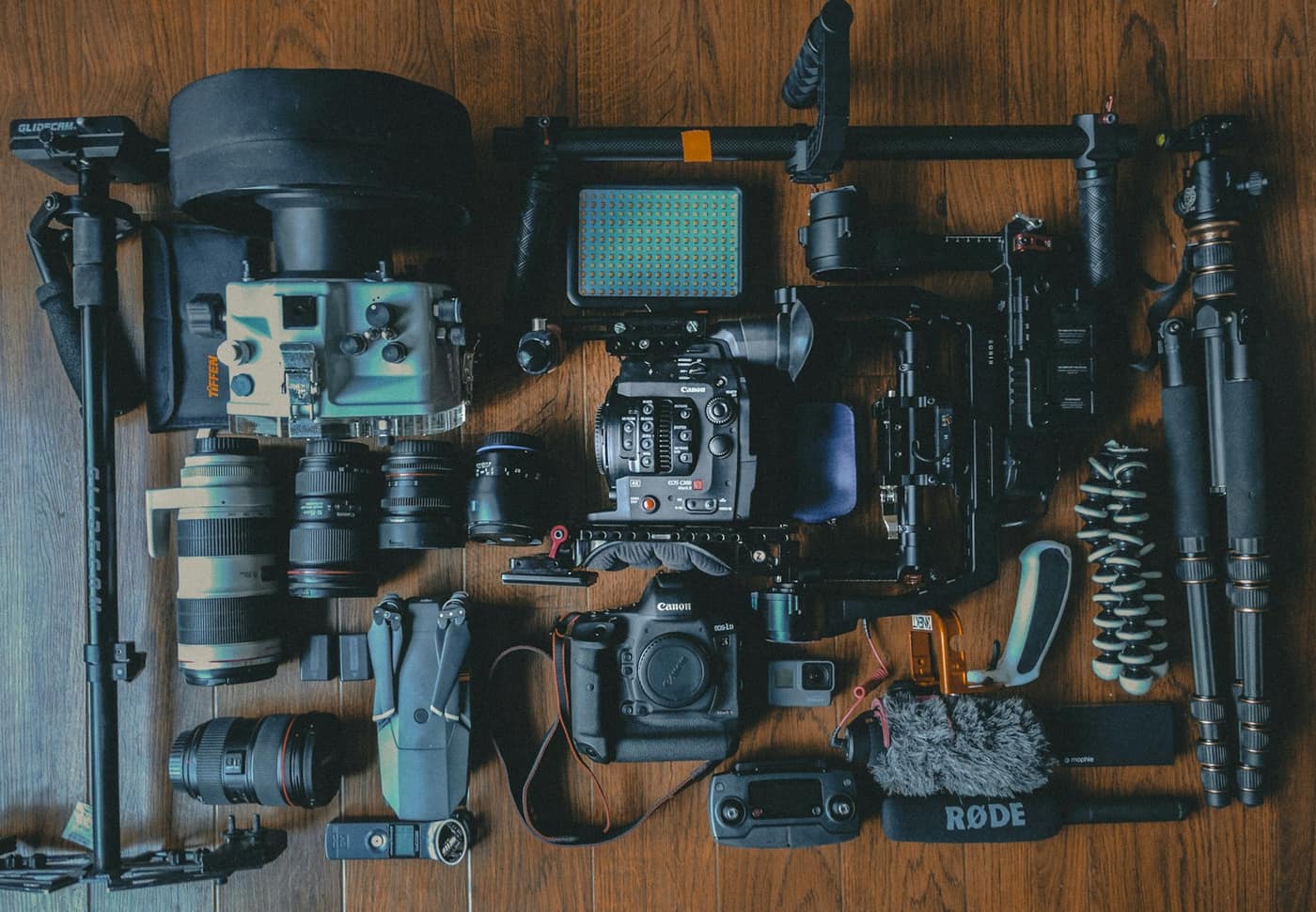 Camera gear and lenses laid out on a table