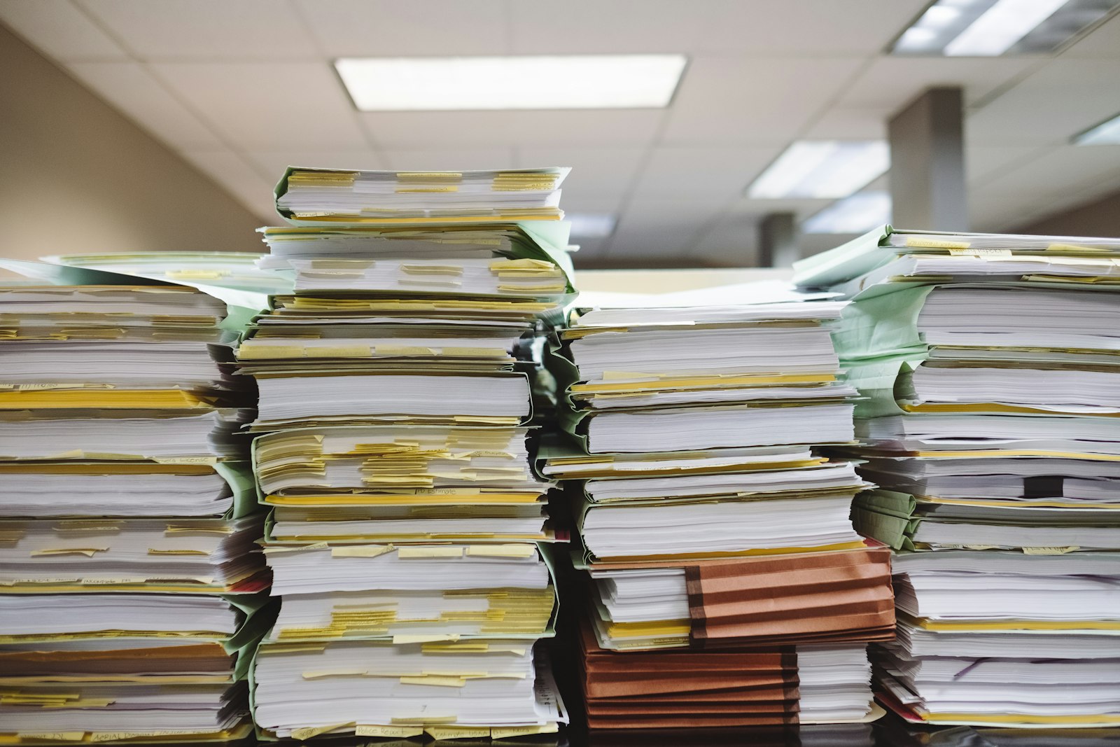 A purchase order and invoice documents on a desk