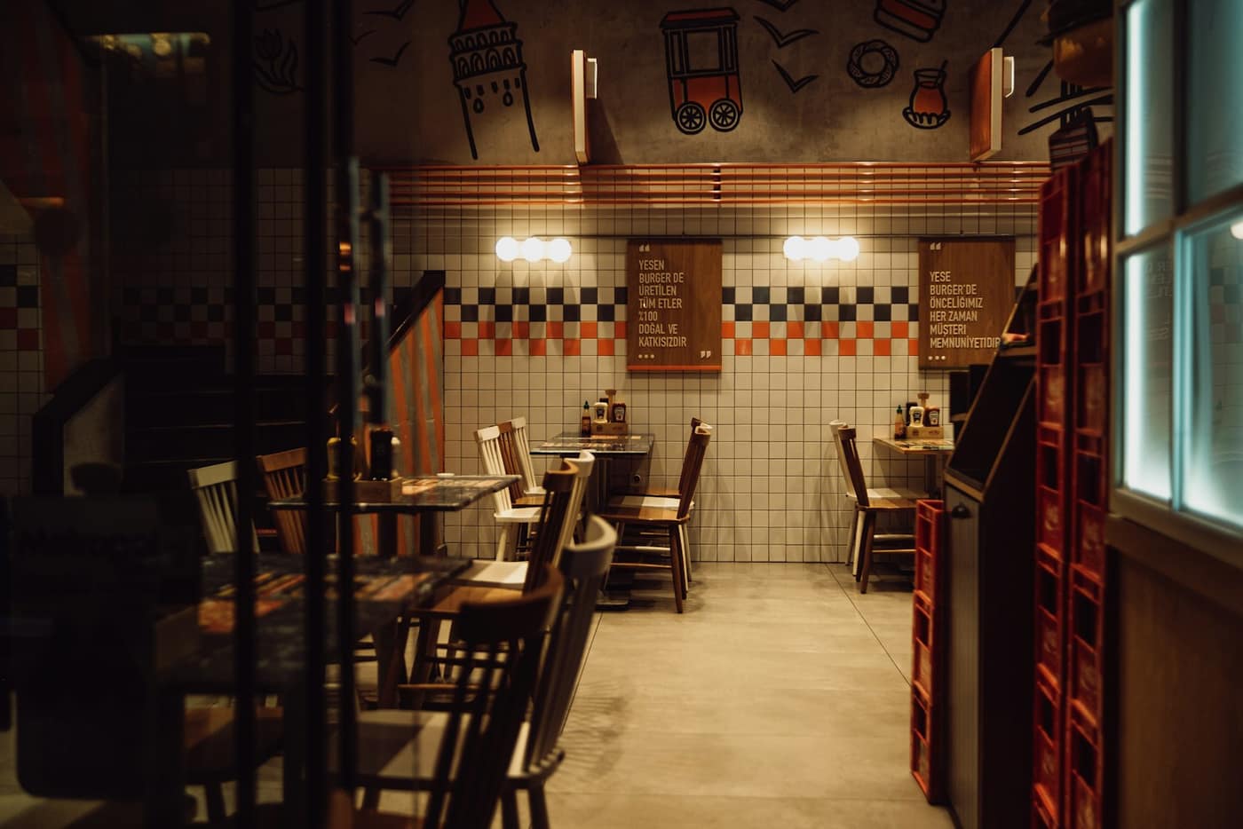 A restaurant interior with set tables and warm lighting