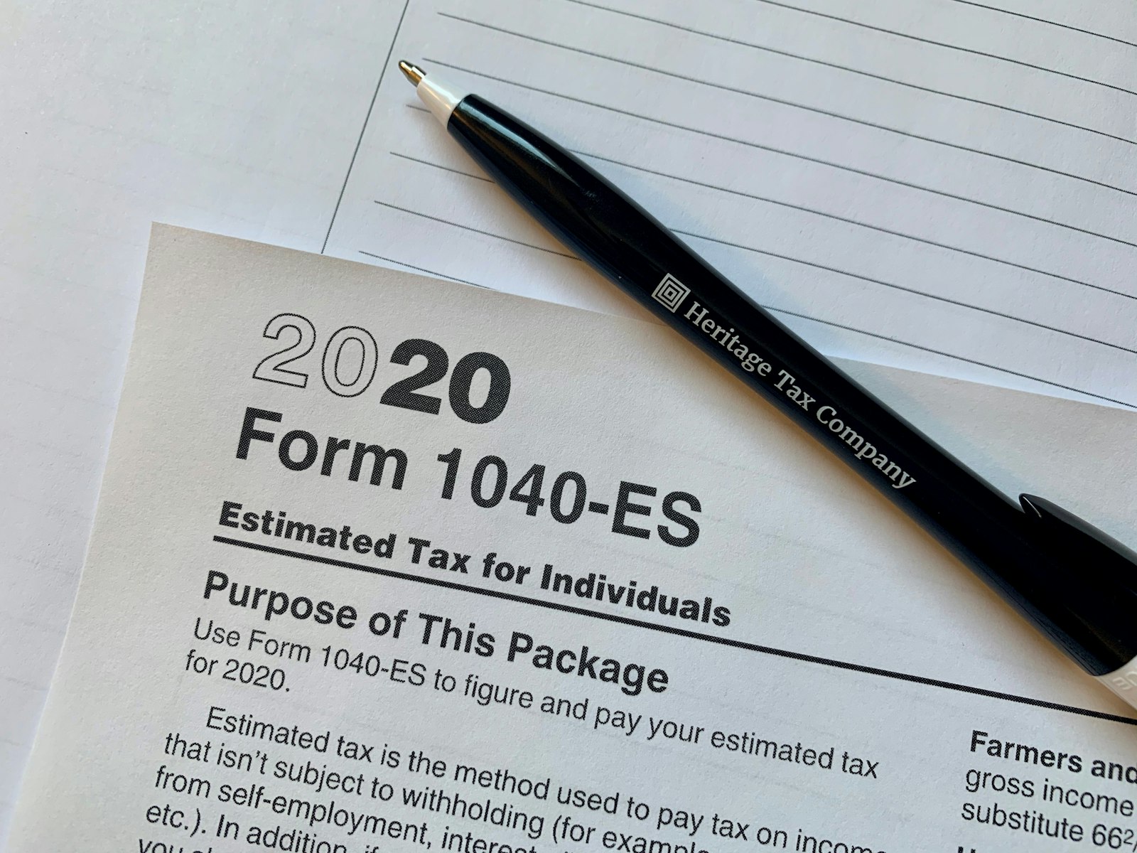 A tax form and pen on a desk